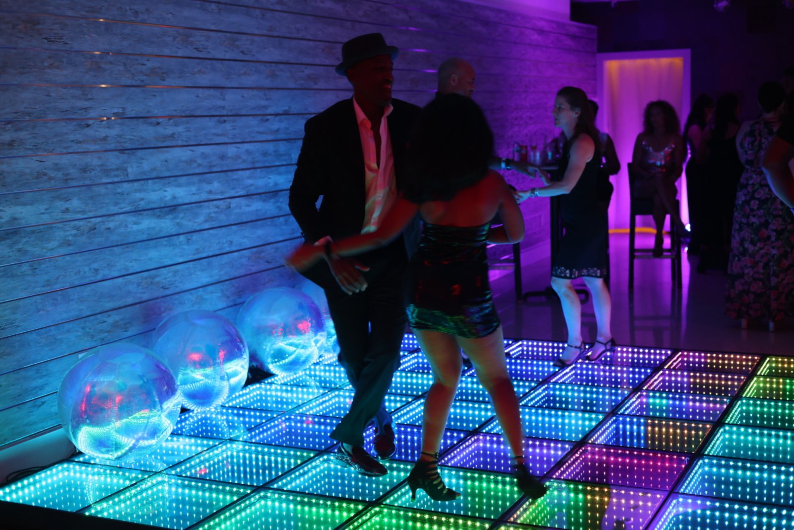 A couple stepping together on the social floor