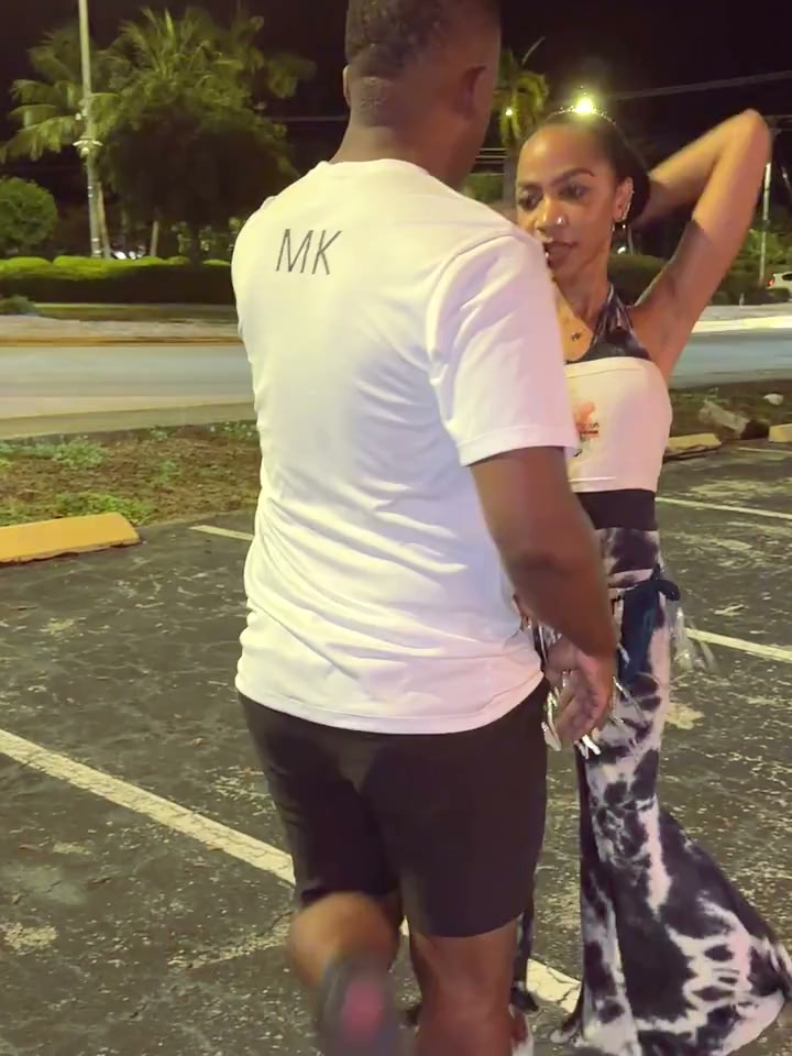 Latin Fusion instructors MK and Jazz dancing in Latin Fusion shirts