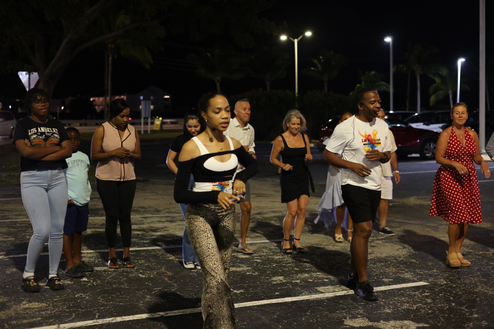 Dancers following salsa steps together outdoors