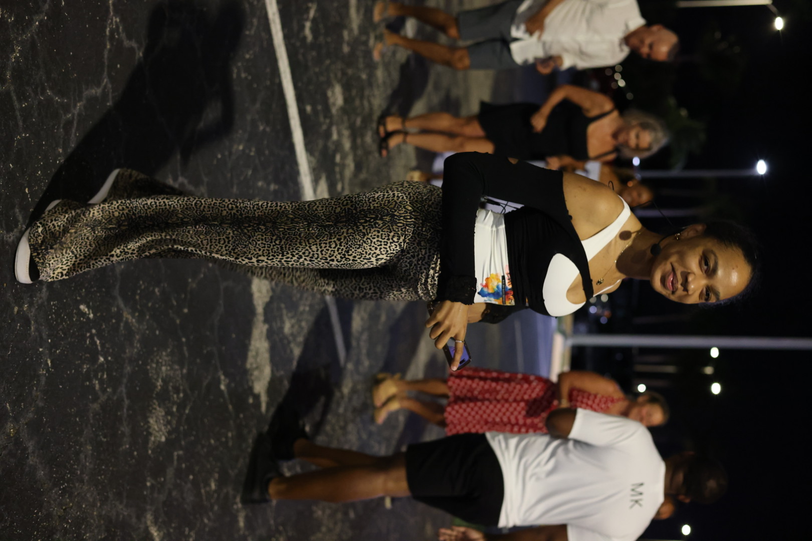 A dancer smiling during the outdoor salsa class